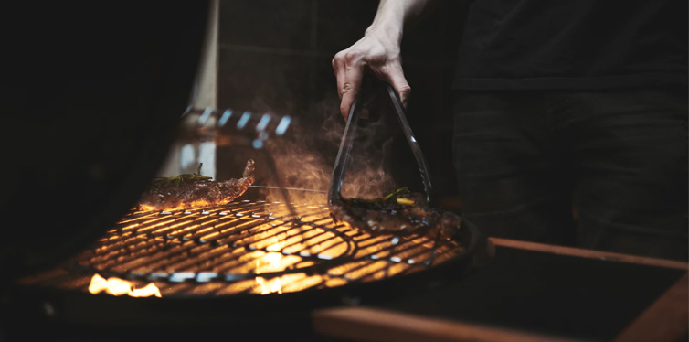 man controlling coals