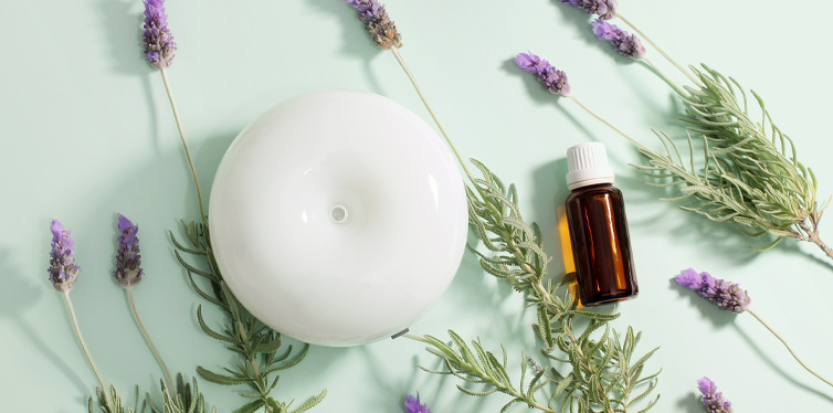 essential oil bottle next to the diffuser