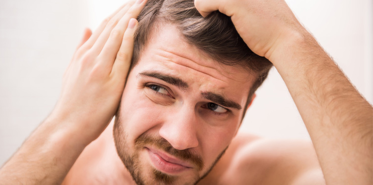 man checking his hair