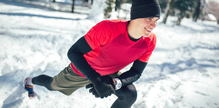 man exercising in winter park