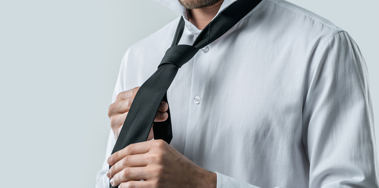 man making his tie knot