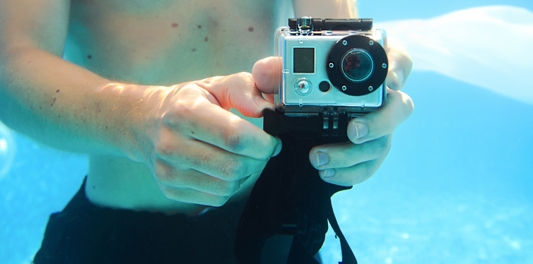 man taking photo underwater