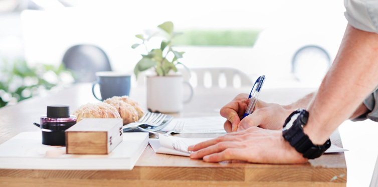 man using a standing desk