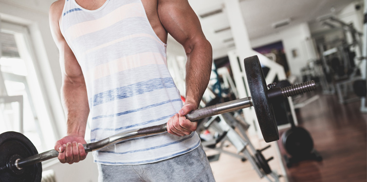 man doing exercise at the gym