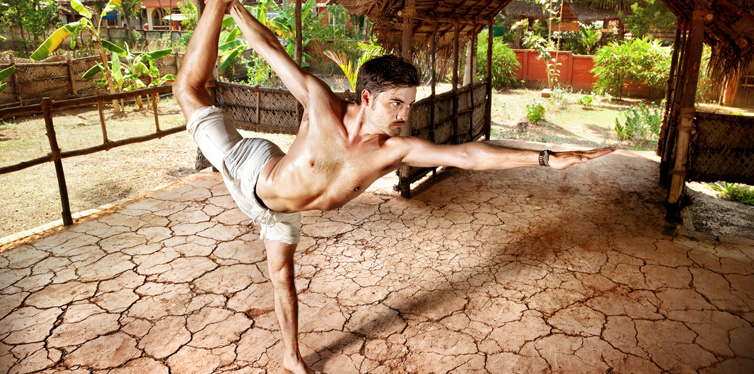 man doing yoga outside