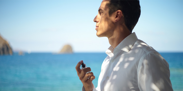man holding a perfume