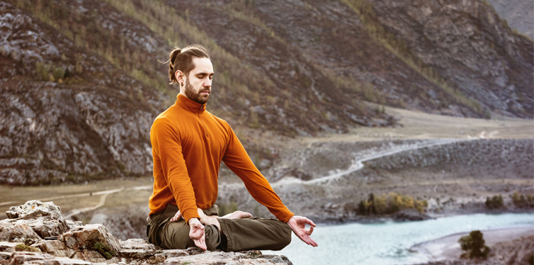 man practicing yoga