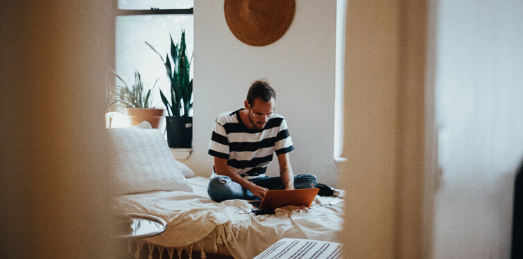 man sitting on the bed
