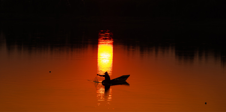 fisherman on the lake