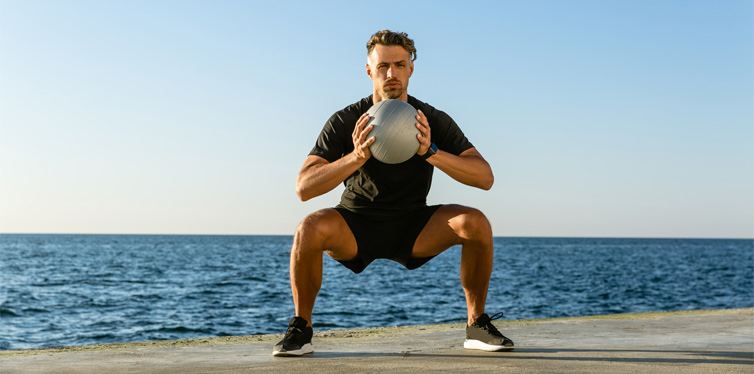 man doing goblet squats