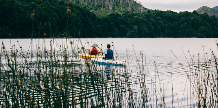 people on the river in kayaks