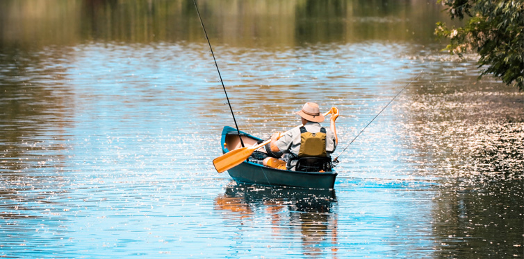 person in a boat fishing