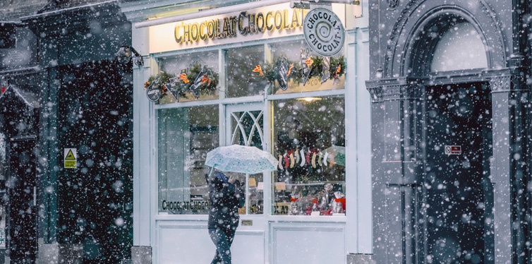 person walking near cafe during winter