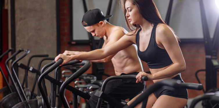 two people on an assault bike