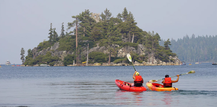 two persons kayaking