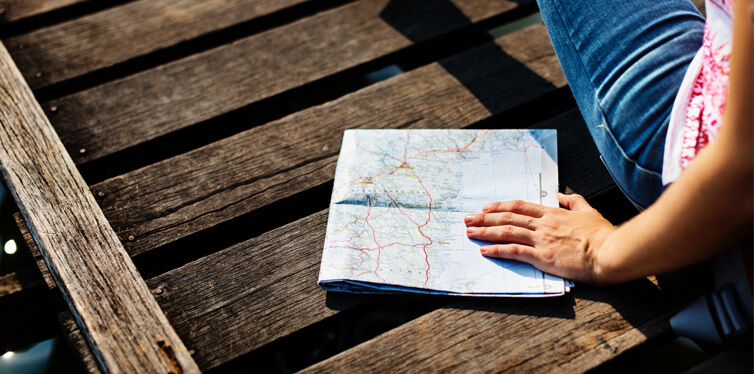 person on holiday with a map