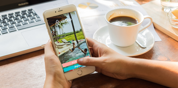 person using airbnb app