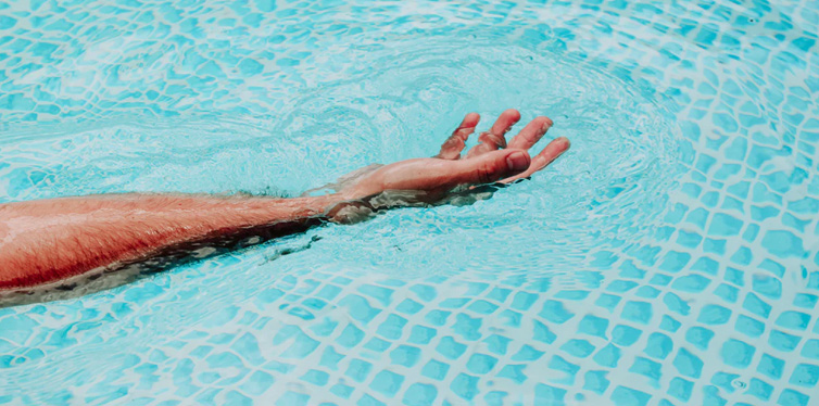 person's hand in water