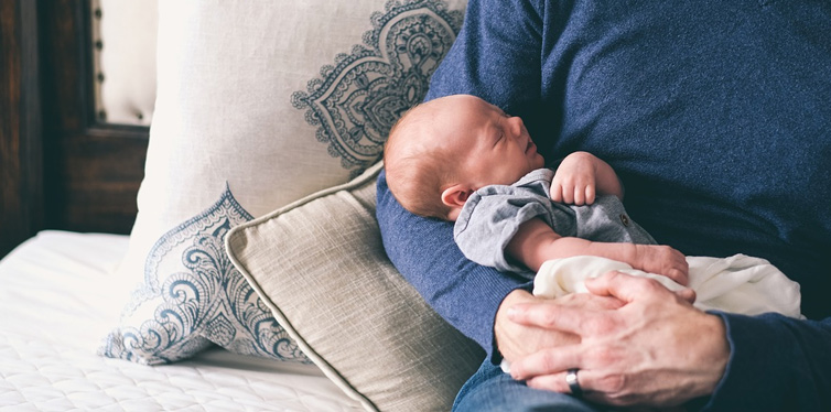 father holding a baby