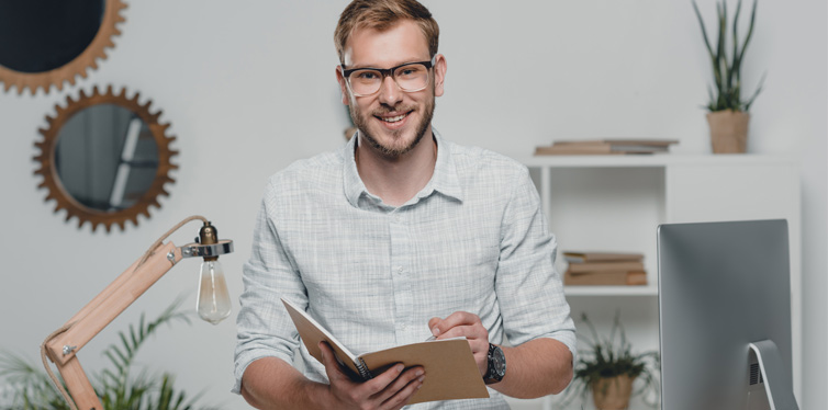 happy man writing in his diary