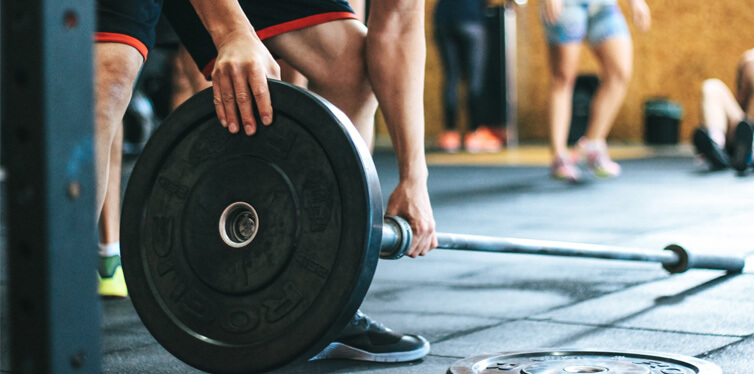 man adjusting weights
