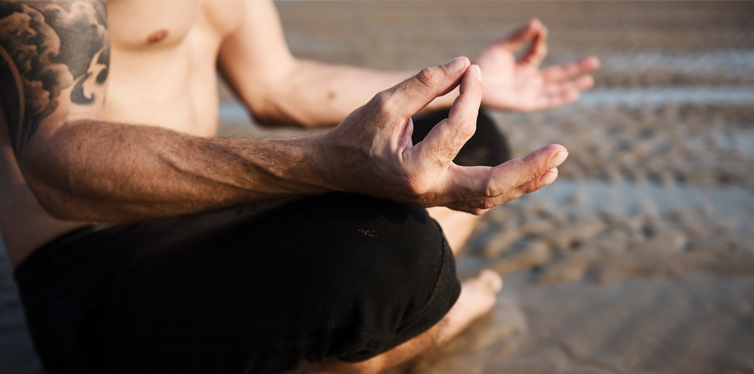 man doing yoga meditation