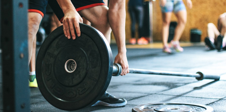 man holding barbell