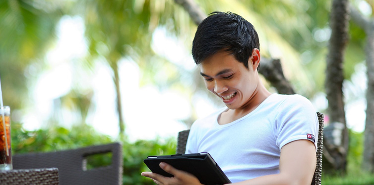 man looking at tablet