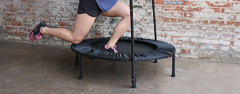 a woman using an exercise trampoline