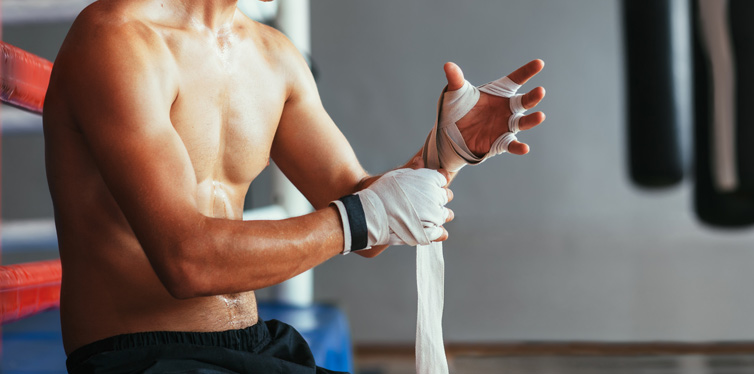 boxer wrapping hands before the match