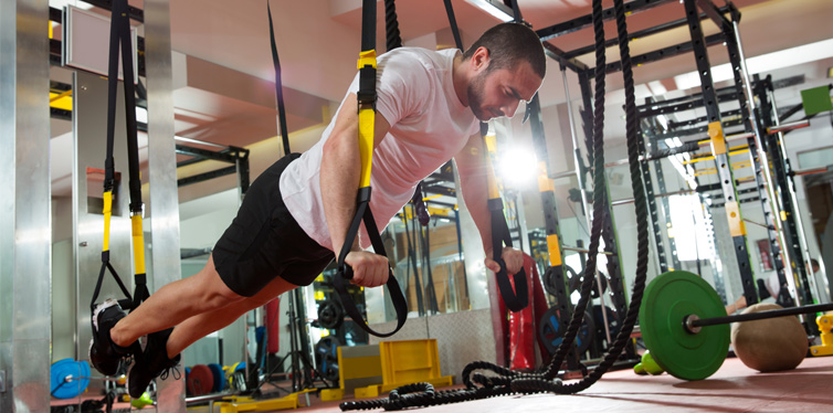 man doing trx workout