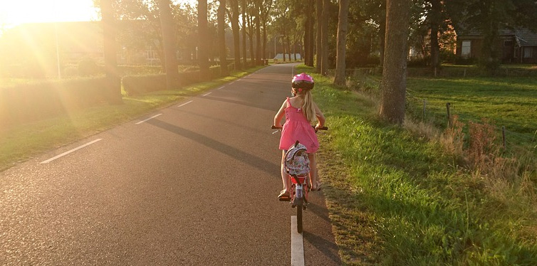 a girl riding a bike