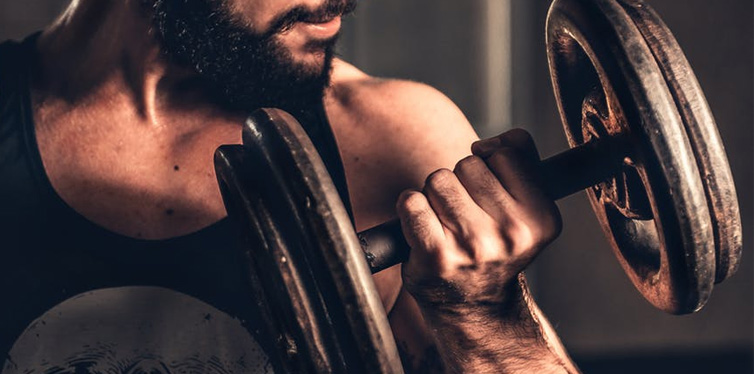 man lifting weights