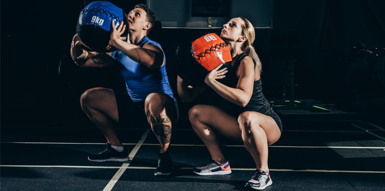 a couple doing squats