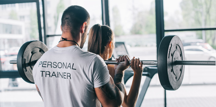 a woman working out with a personal trainer