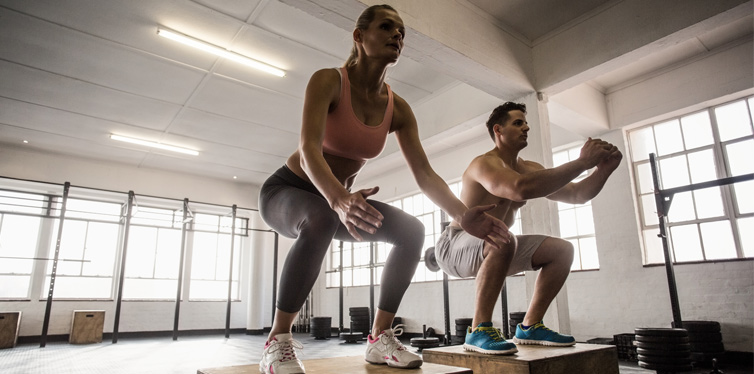 doing squats in a gym