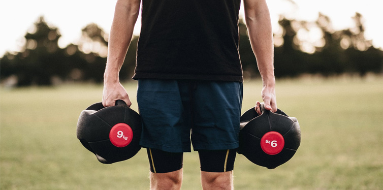 man holding dumbbells