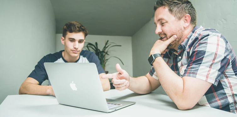 people looking at the computer