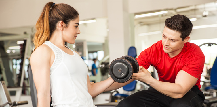 weightlifting with a personal trainer