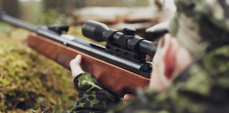 hunter holding a gun