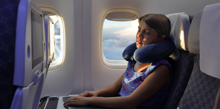 girl sleeping on a plane