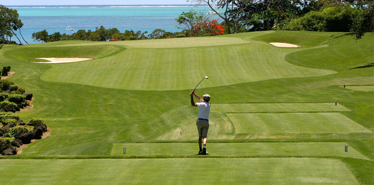 man at the golf course by the sea