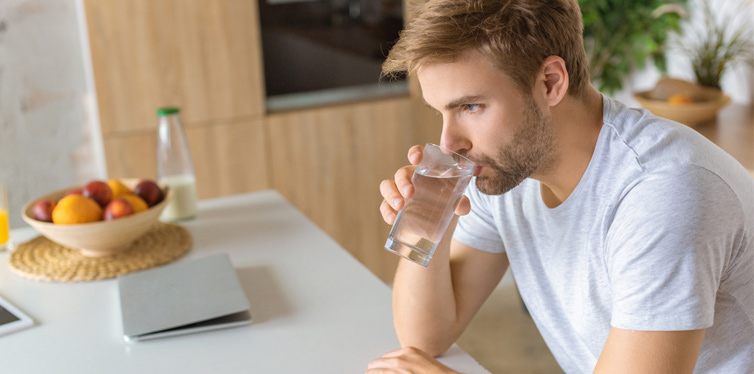 man drinking water