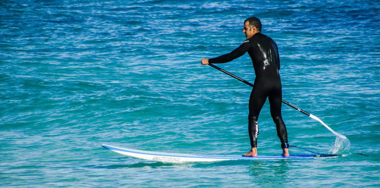 man paddleboarding