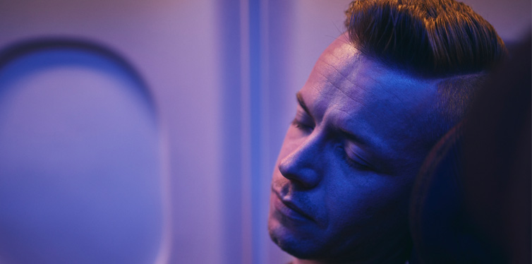 man sleeping on the flight