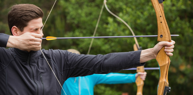 man using a bow