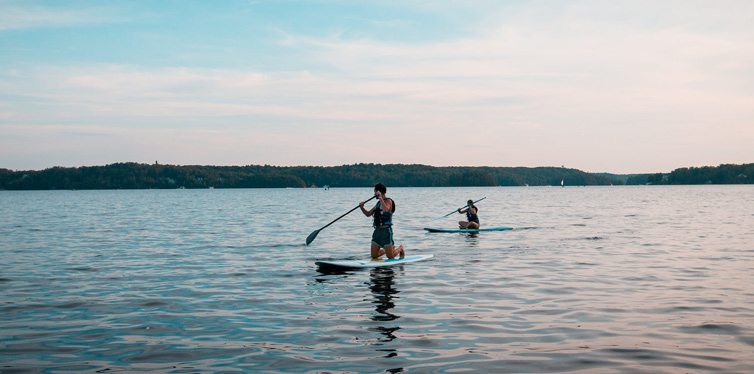 men paddle boarding