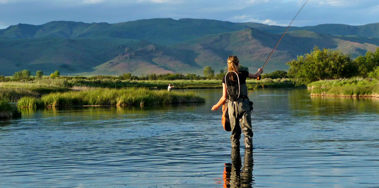 woman fly fishing