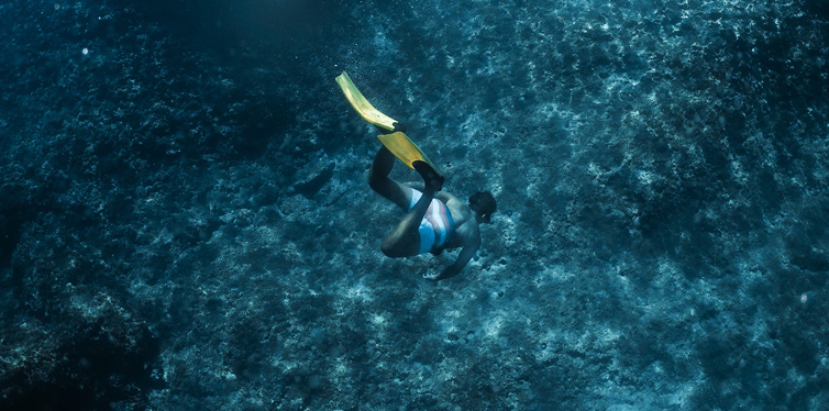 man snorkeling in the sea