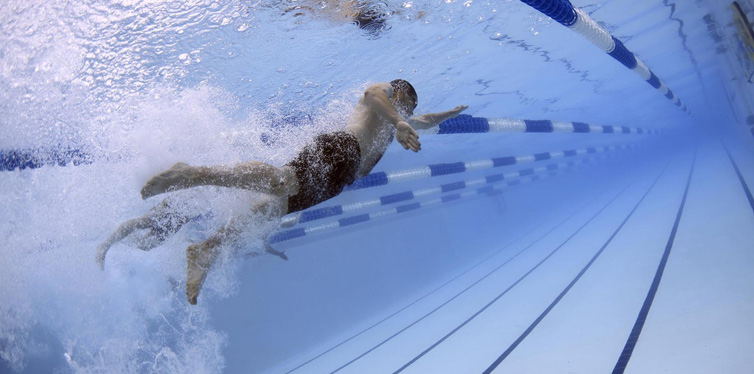 man swimming in the pool
